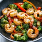 Close-up of shrimp and sausage stir fry plated for dinner